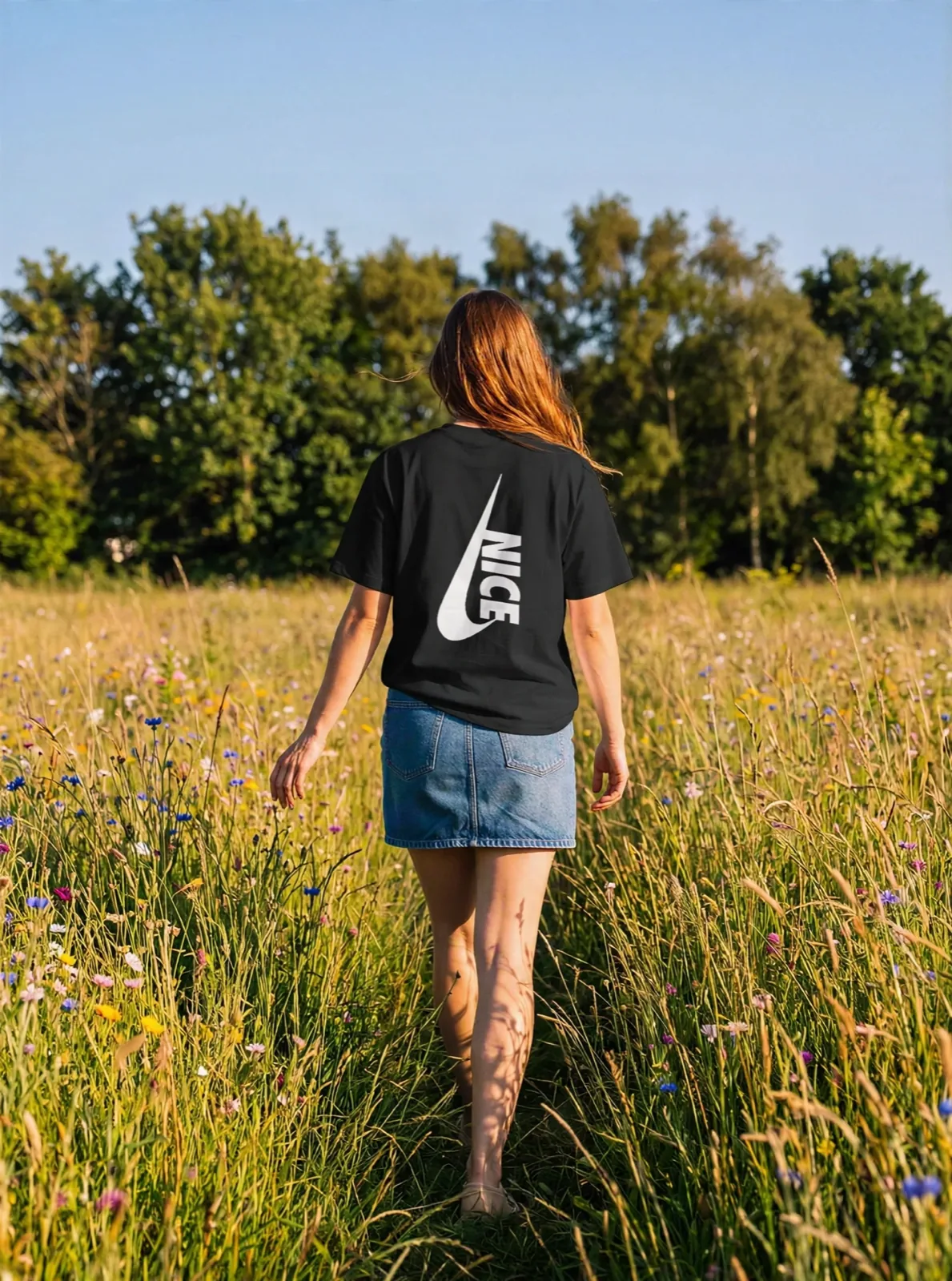 Nice Tick Backprint tee in black in a meadow