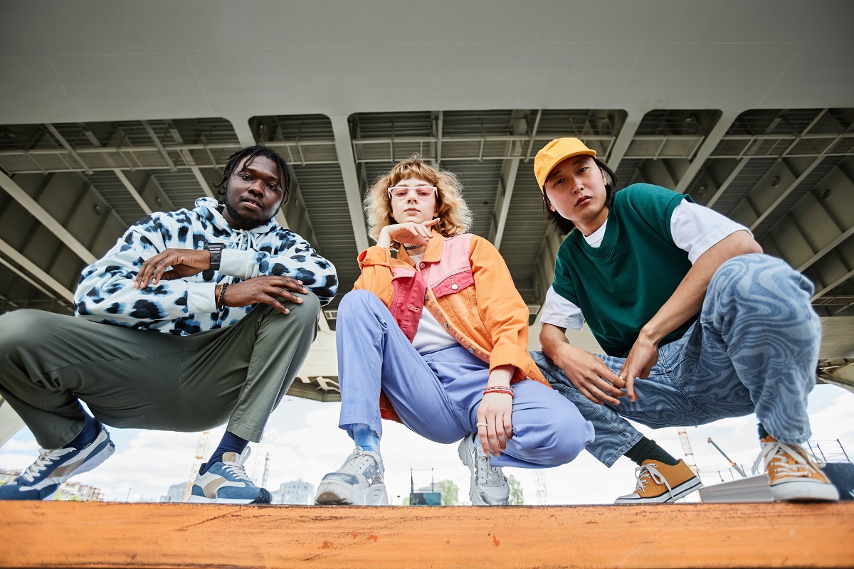 A model styled in layered urban streetwear, showcasing a casual, edgy outfit emblematic of contemporary streetwear design.