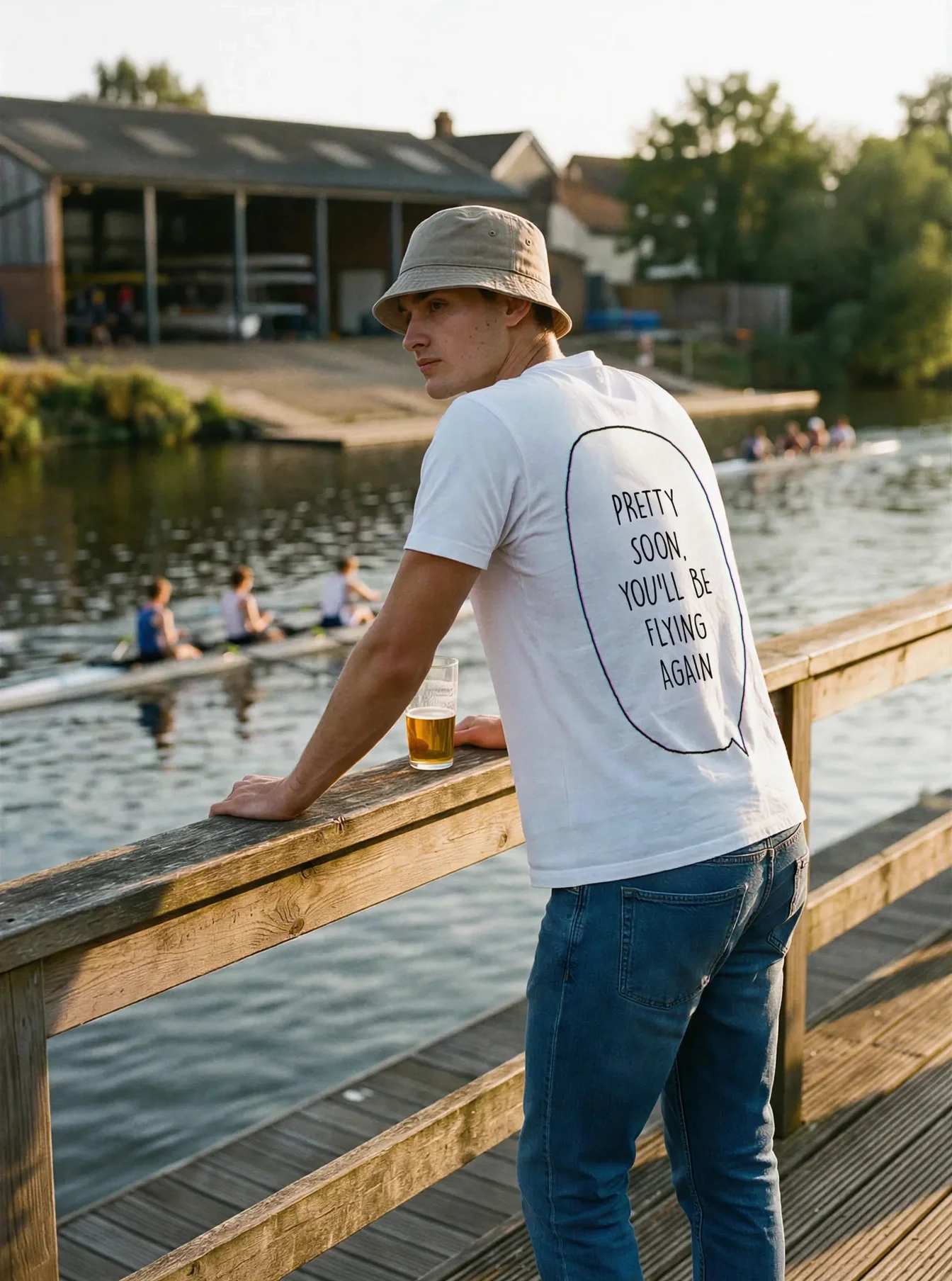 "pretty soon, you'll be flying again" Backprint Tee worn by a model