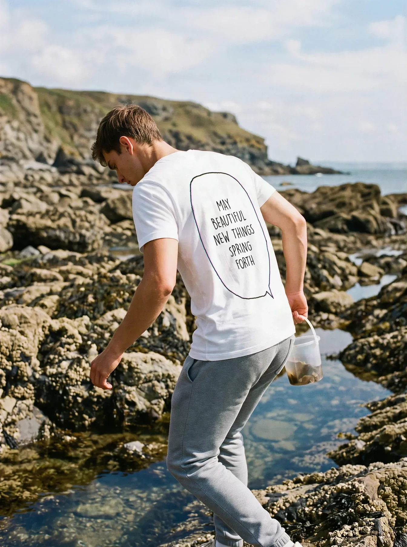 "MAY BEAUTIFUL NEW THINGS SPRING FORTH" Backprint Tee worn by a model