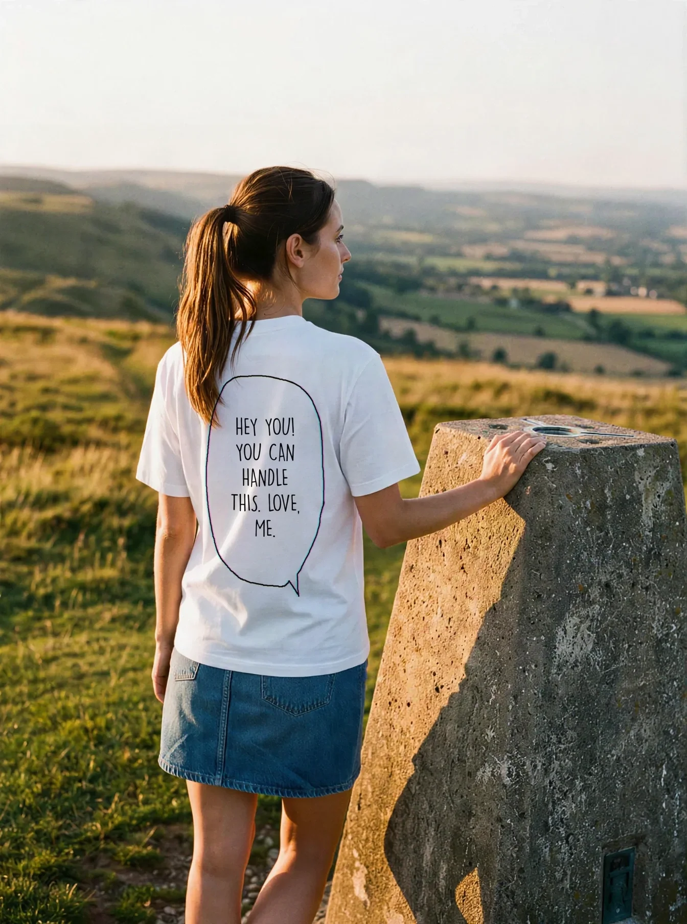 "HEY YOU! YOU CAN HANDLE THIS. LOVE, ME." Backprint Tee worn by a model