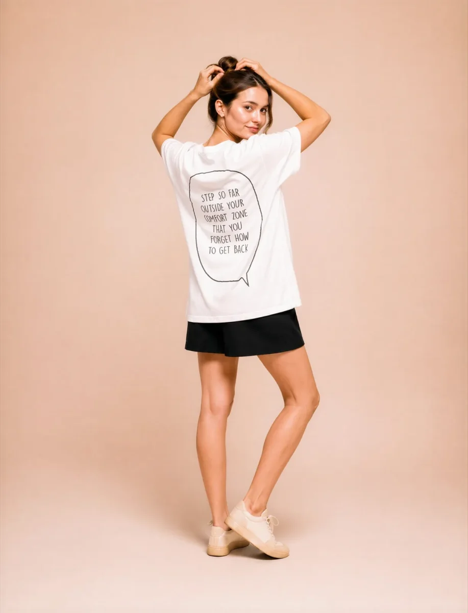 "Step outside your comfort zone & forget how to get back." Backprint Tee, back view, Its.That.
