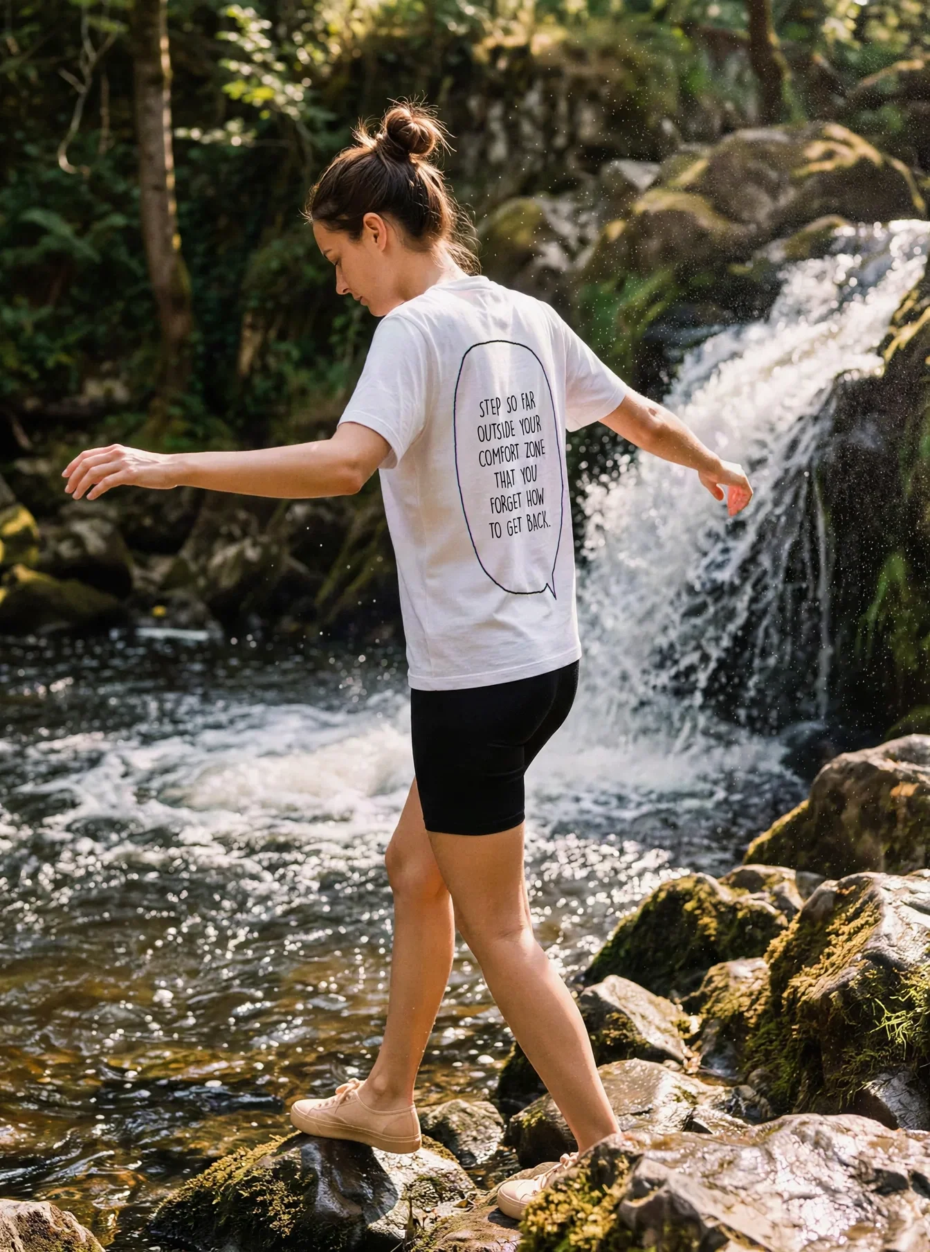 "Step outside your comfort zone & forget how to get back." Backprint Tee worn by a model