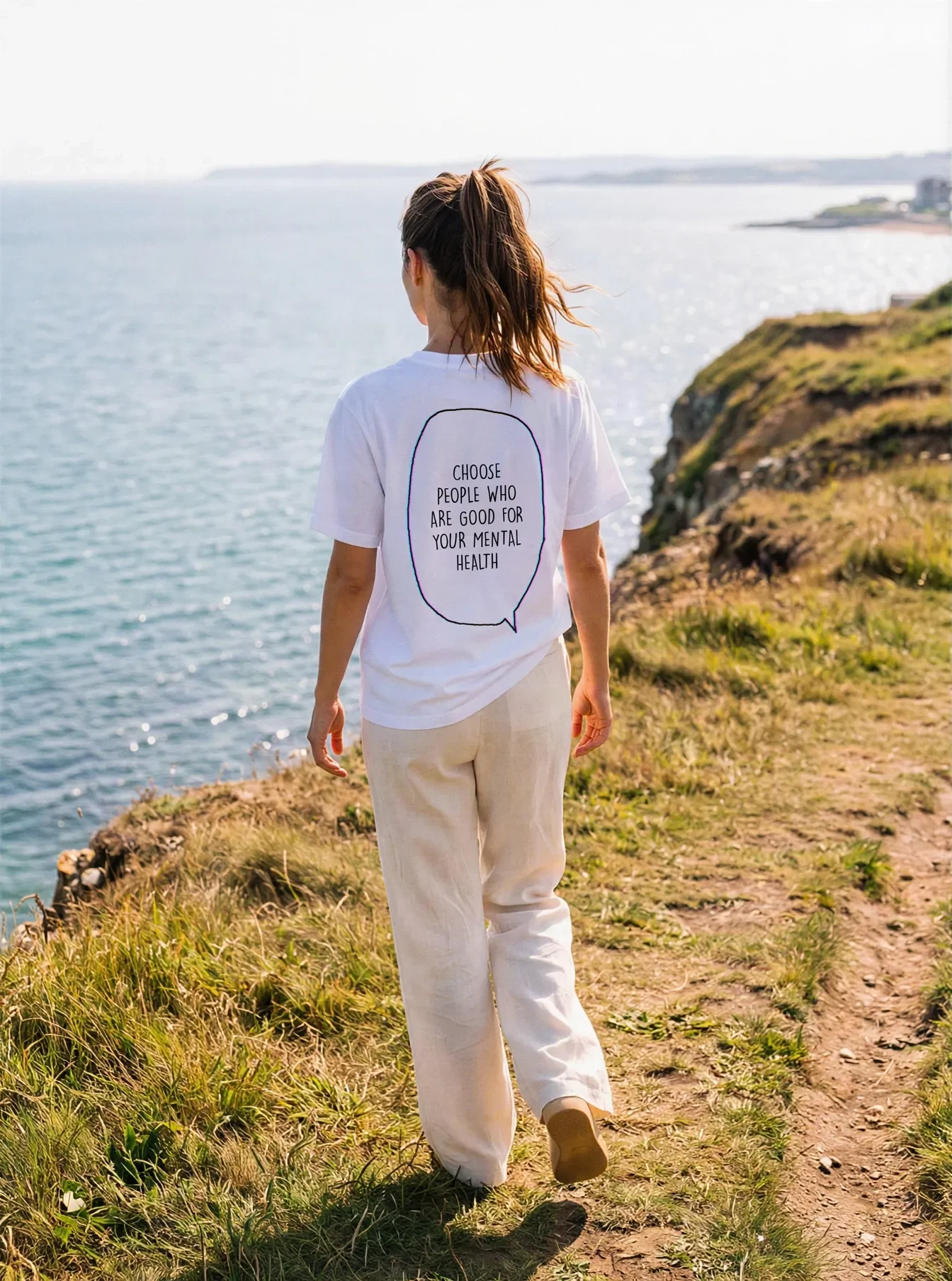 "Choose people who are good for your mental health" Backprint Tee worn by a model