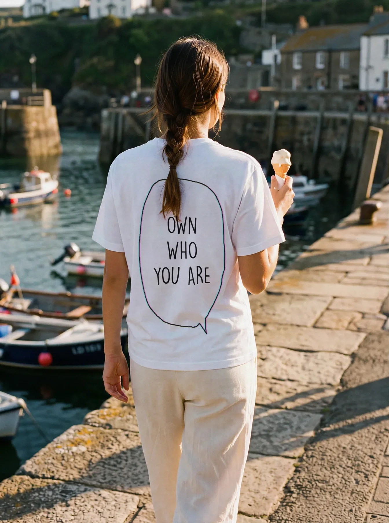 "Own who you are" Backprint Tee worn by a model