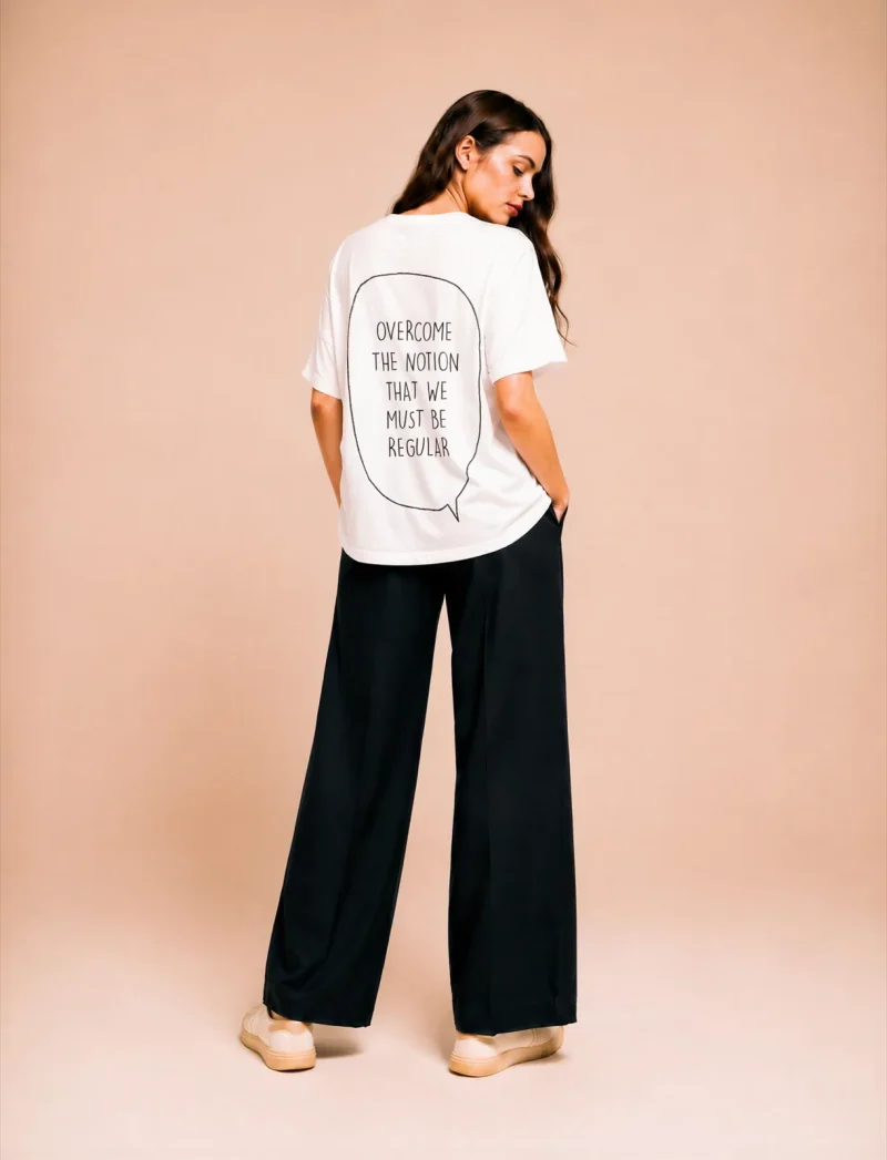 "Overcome the notion that we must be regular" Backprint Tee, front view, Its.That.