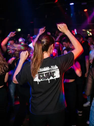 'Graffiti' CMYK Word-art | Backprint T-shirt worn by a model