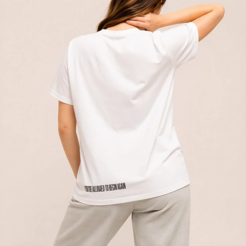 "You're allowed to begin again" Backprint Tee, back view, Its.That.