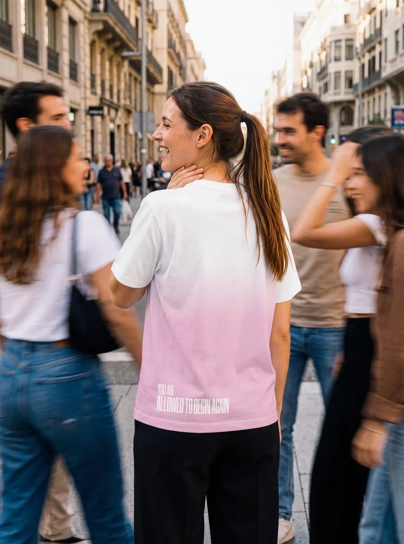 "You're allowed to begin again" Backprint Tee worn by a model