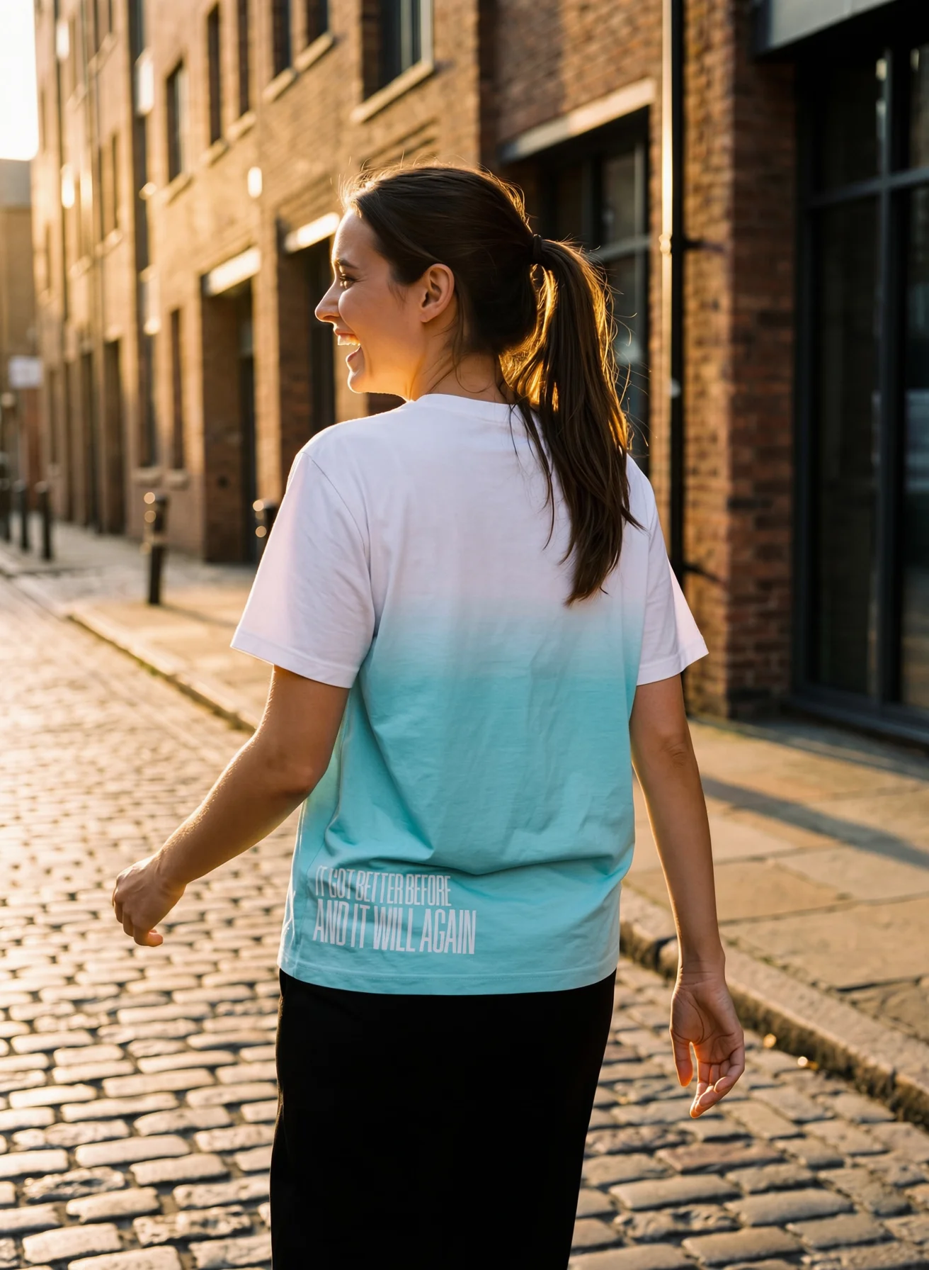 "it got better before and it will again" Backprint Tee worn by a model