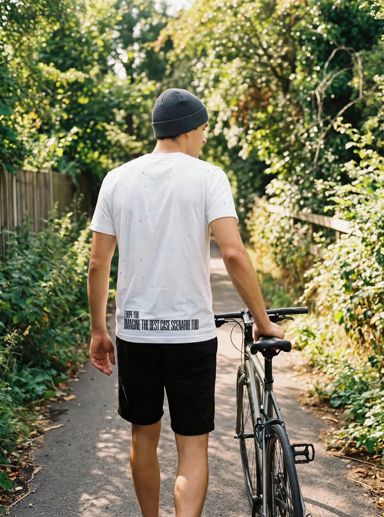 "imagine the best case scenario too" Backprint Tee worn by a model