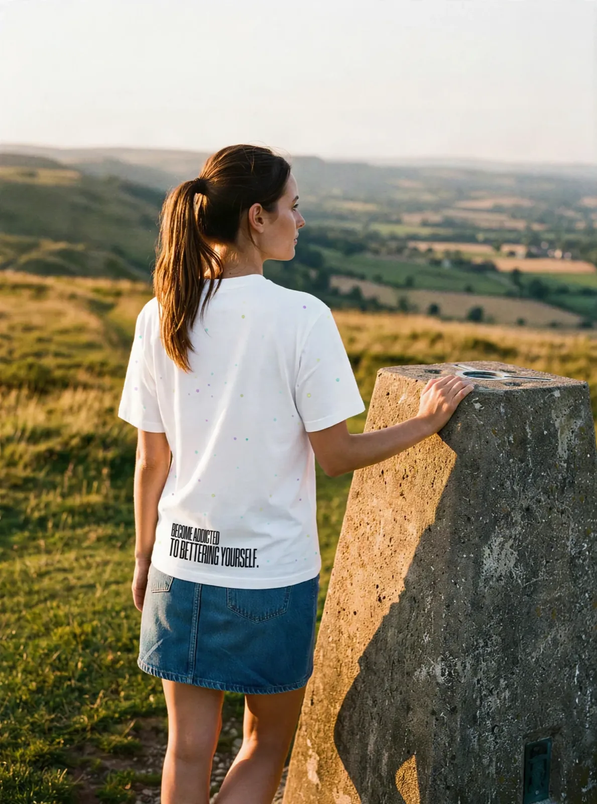 "BECOME ADDICTED TO BETTERING YOURSELF." Backprint Tee, on model