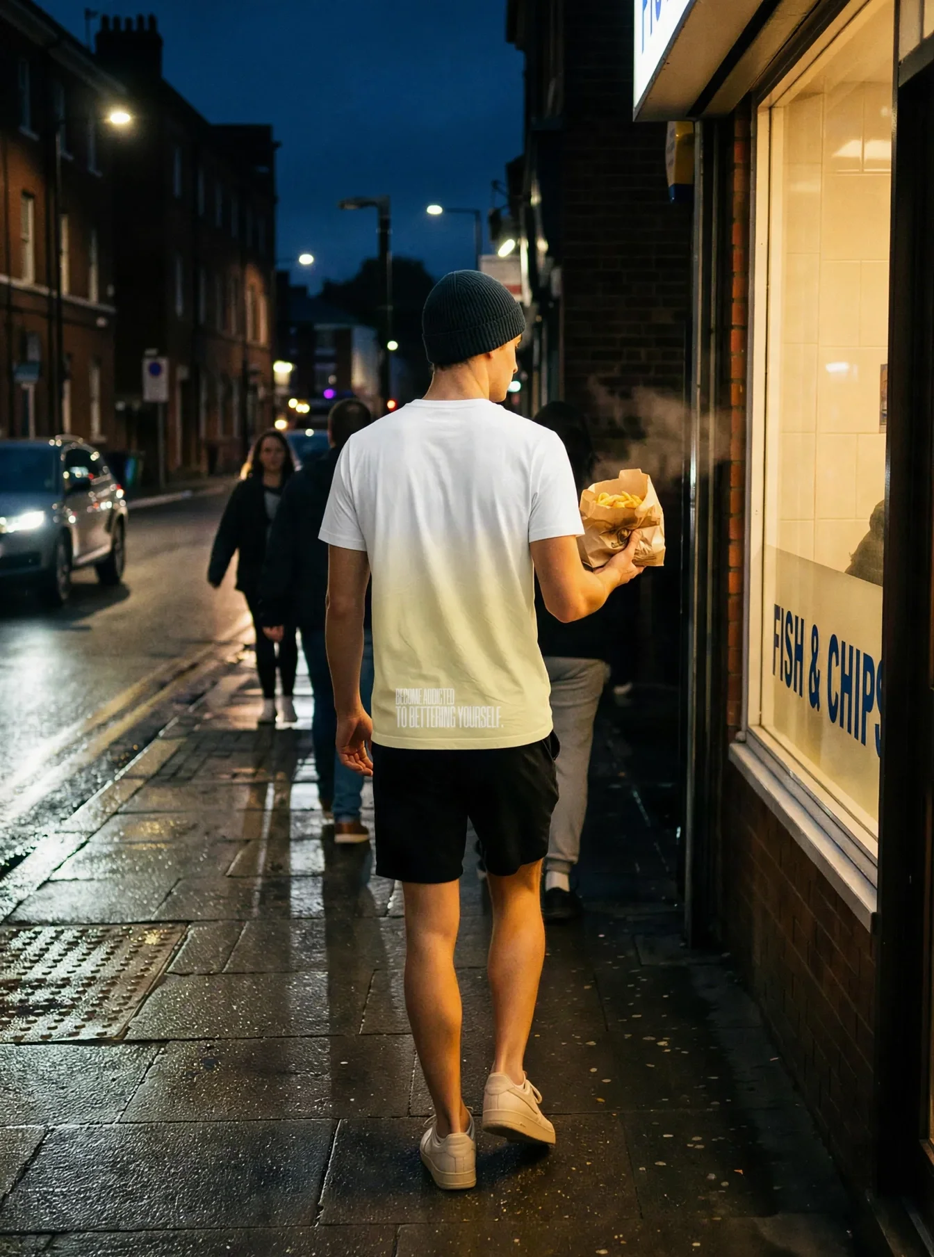 "BECOME ADDICTED TO BETTERING YOURSELF." Backprint Tee worn by a model