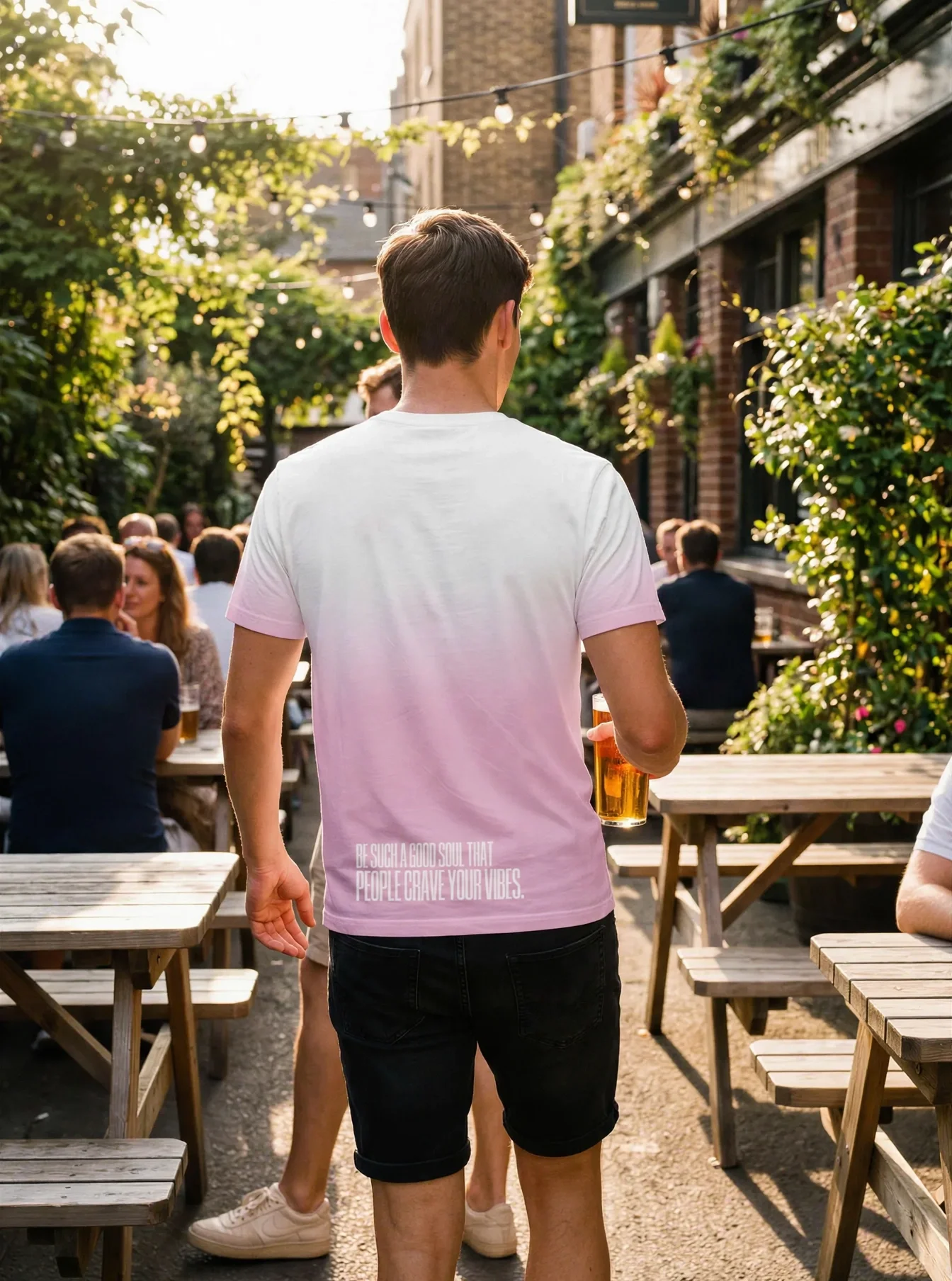 "Be such a good soul that people crave your vibes." Backprint Tee worn by a model