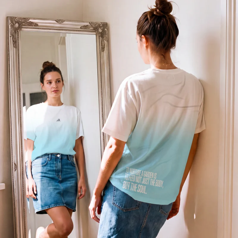 "To nurture a garden is to feed not just the body, but the soul." Backprint Tee worn by a model