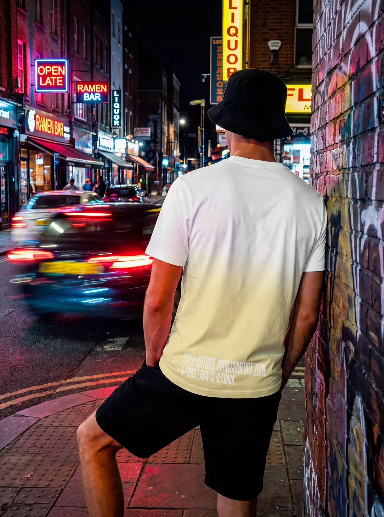 "Step outside your comfort zone & forget how to get back." Backprint Tee worn by a model