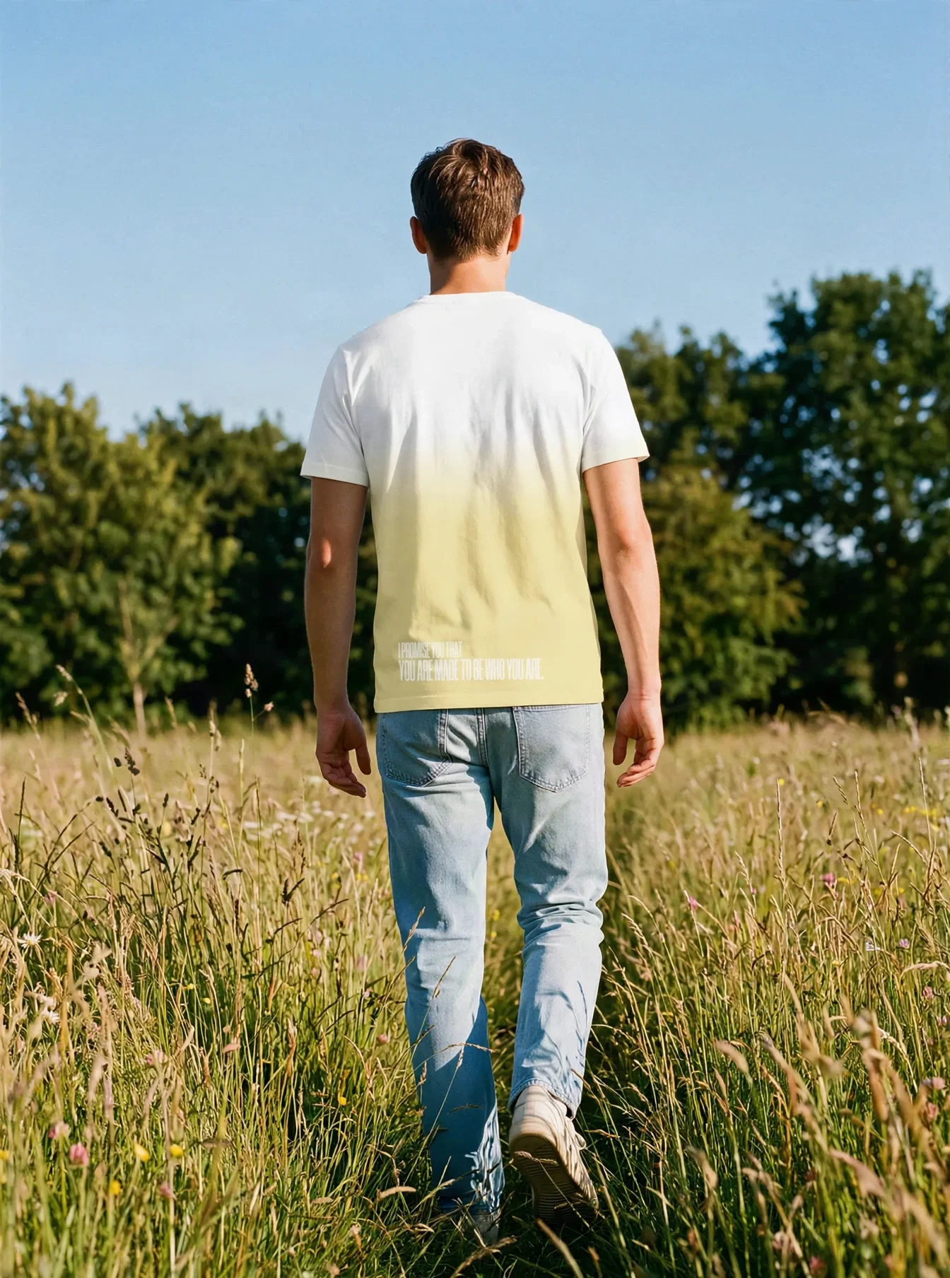 "I PROMISE YOU THAT YOU ARE MADE TO BE WHO YOU ARE." Backprint Tee worn by a model