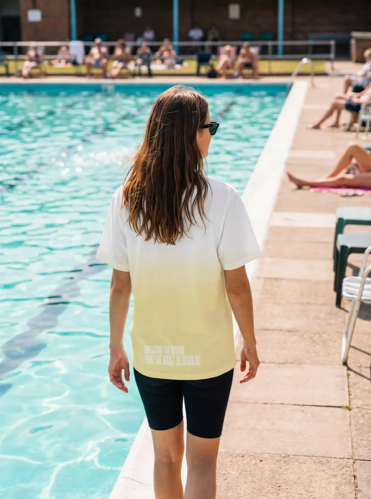 "Overcome the notion that we must be regular" Backprint Tee (Hem Print), on model