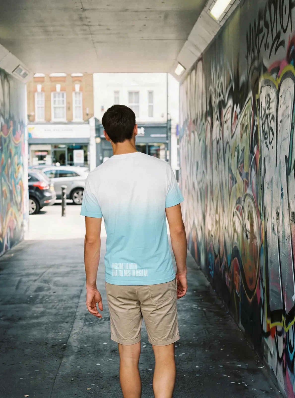 "Overcome the notion that we must be regular" Backprint Tee (Hem Print), on model