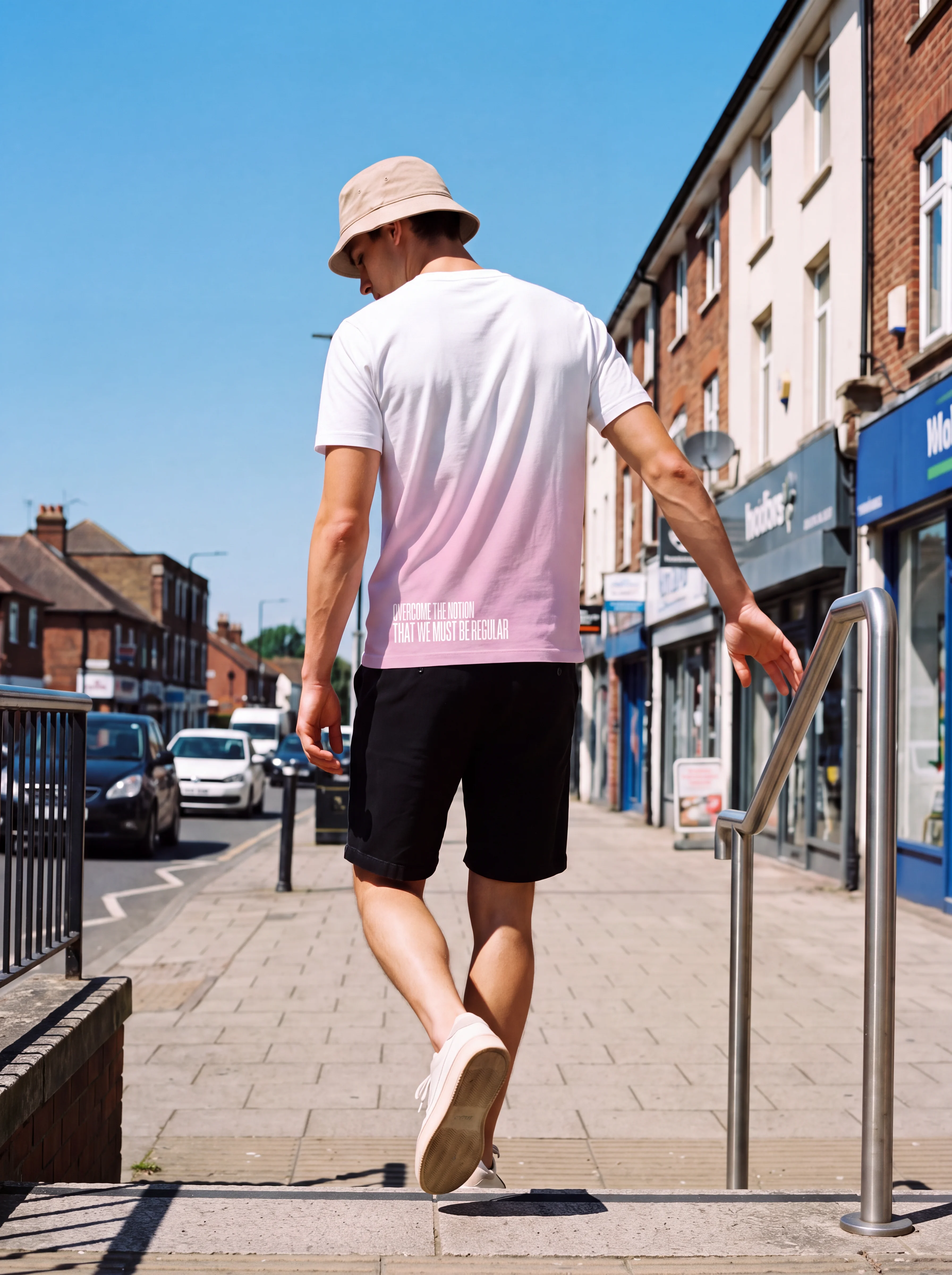 "Overcome the notion that we must be regular" Backprint Tee worn by a model