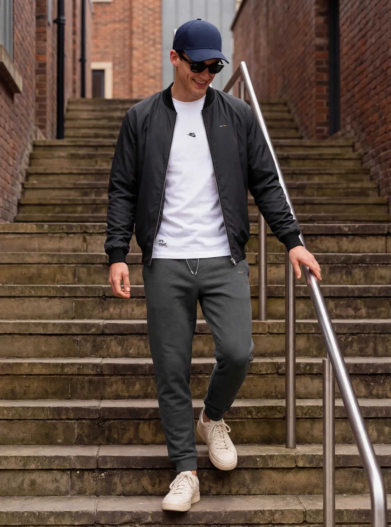 Charcoal Bomber worn with joggers and a white tee, on model